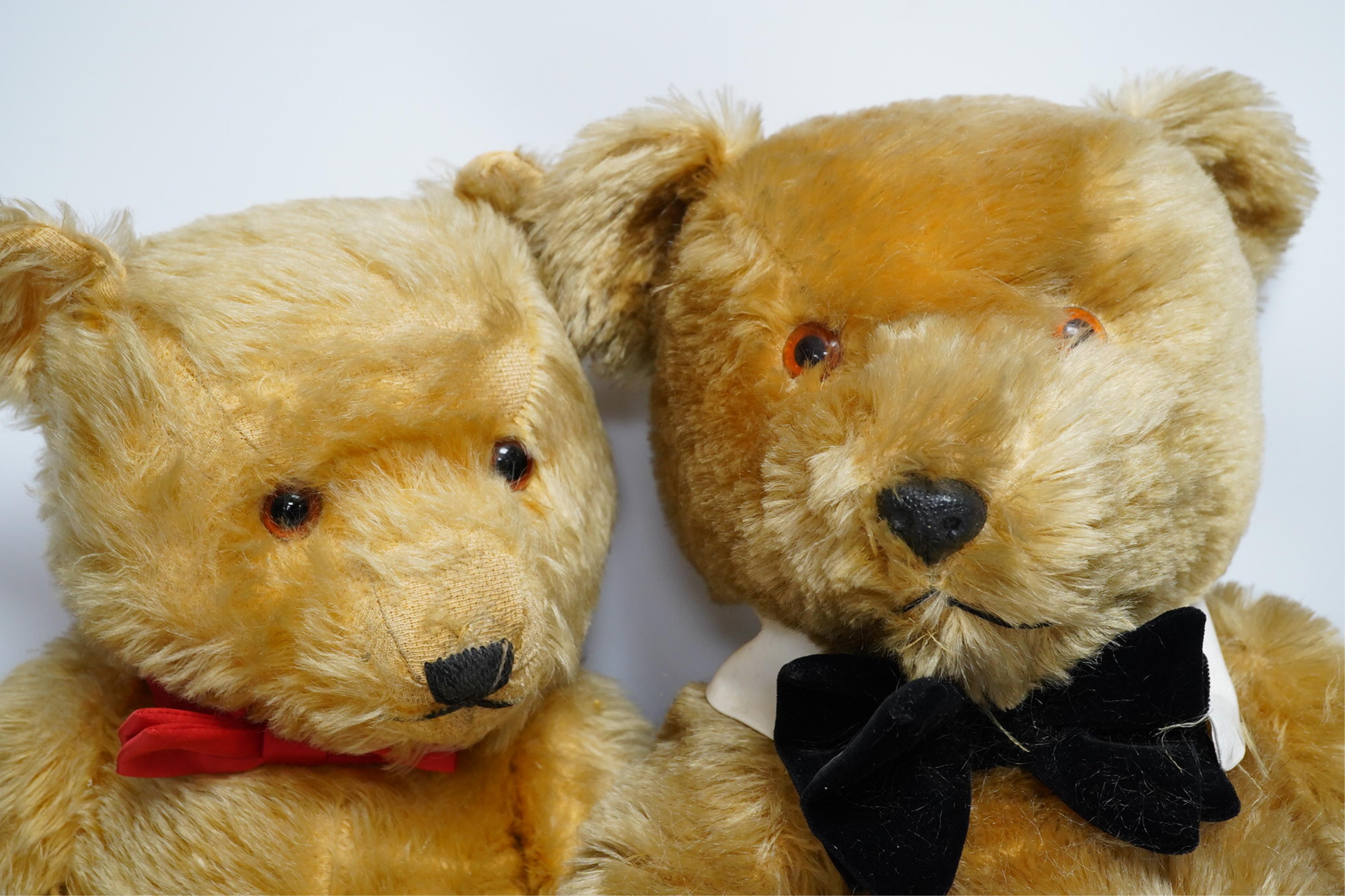 A Chiltern Hugmee teddy bear, with velvet paw pads, 59cm high, and a Chiltern Hugmee teddy bear, with oil cloth paw pads, some hair loss (2). Condition - fair